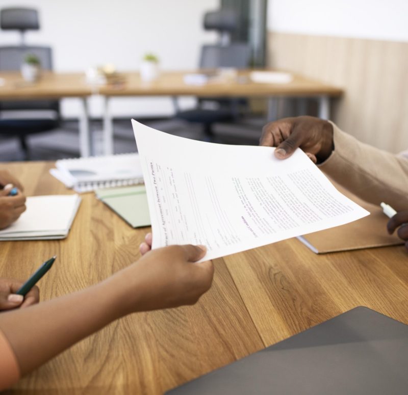 man-holding-contract-his-new-office-job-after-interview (1) man-holding-contract-his-new-office-job-after-interview (1)